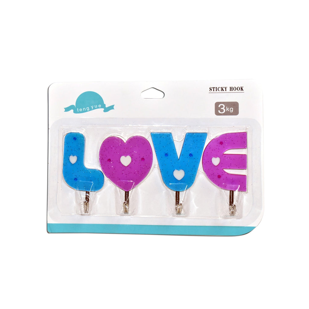 Multiple love shape self adhesive hooks organized on a kitchen wall.