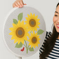 Sunflower mesh fan cover fitted on a ceiling fan