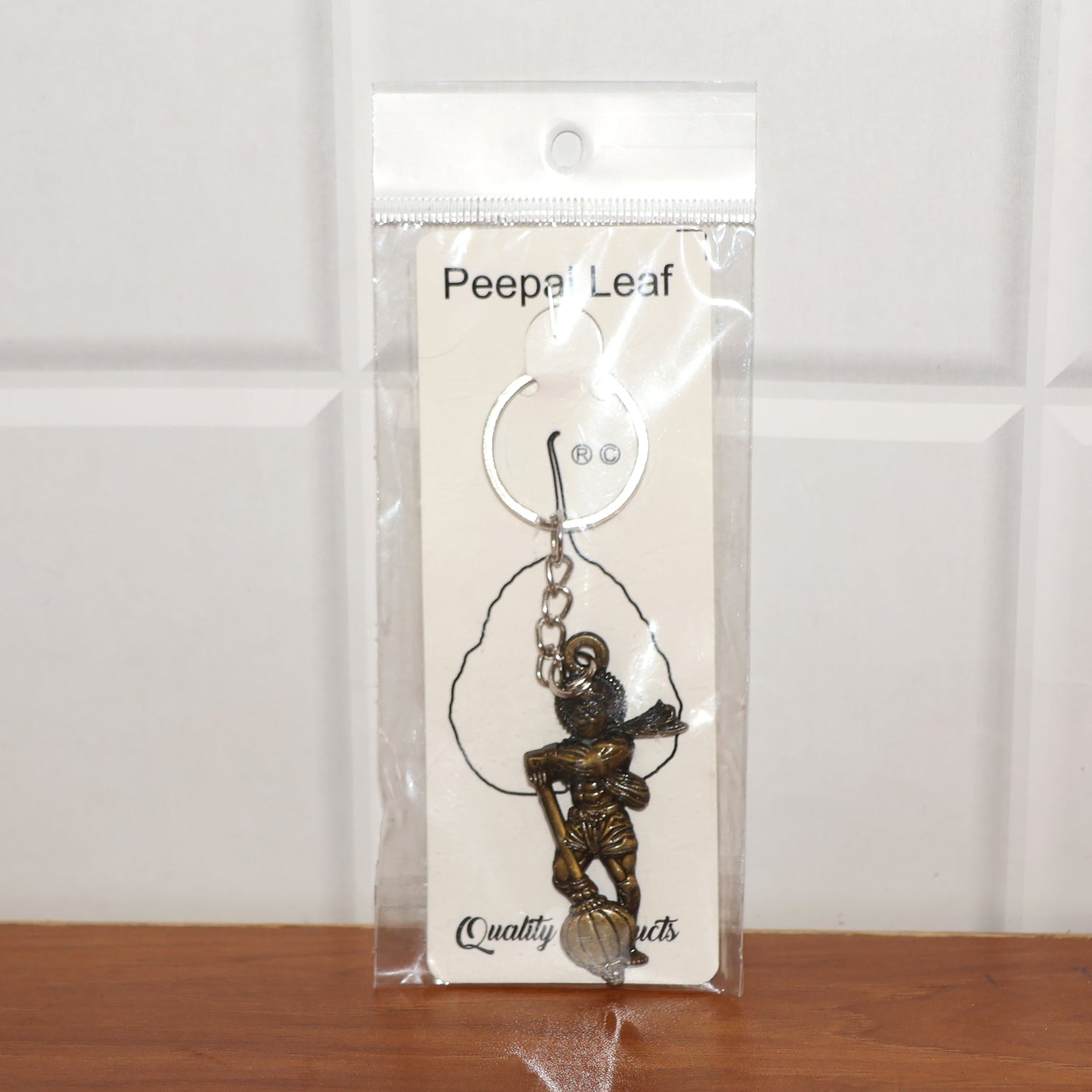 Lord Hanuman metal keychain packaged in Peepal leaf blister pack
