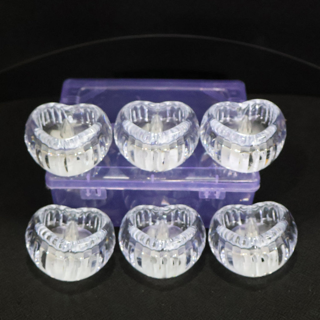 Battery powered LED crystal tealight candles set illuminating room