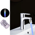 LED faucet light streaming a colorful water flow from kitchen tap