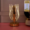 Elegant crystal-effect LED table lamp illuminating bedside table