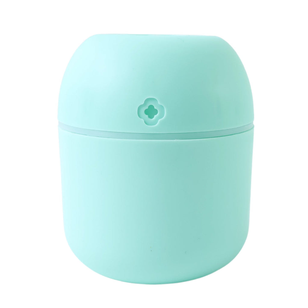 Lifestyle shot of the Mini USB Humidifier placed in a comfortable living space.