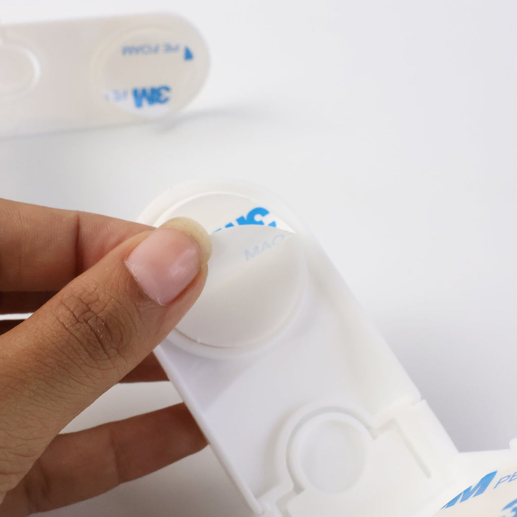 Installed baby safety corner lock on furniture for childproofing