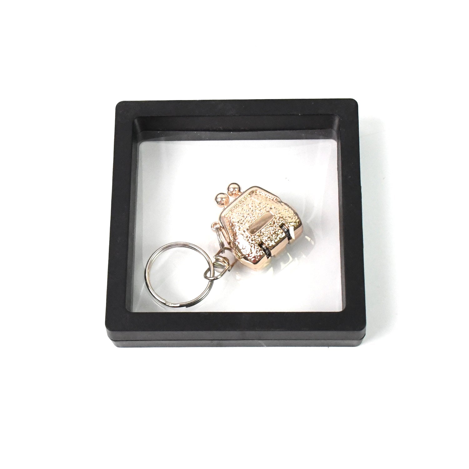 Mini nail clipper keychain in clear showcase with 3D floating effect