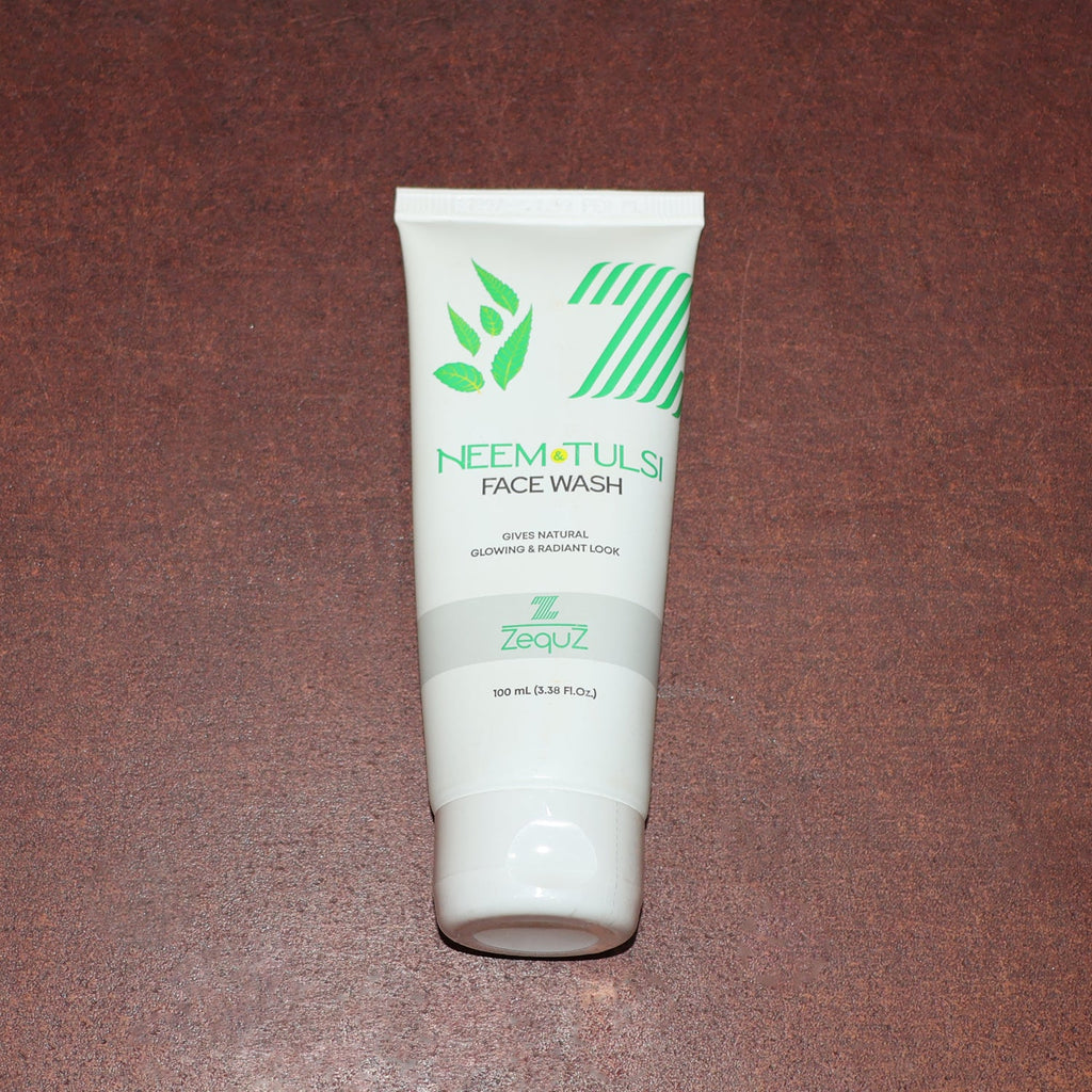 Zequz face wash tube with natural Neem and Tulsi leaves background