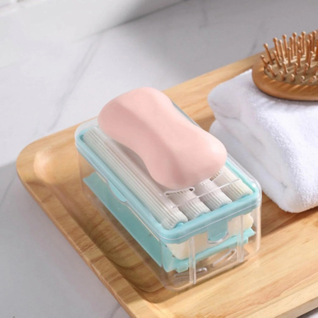 Portable detergent bar holder with a built-in roller brush, ideal for travel.