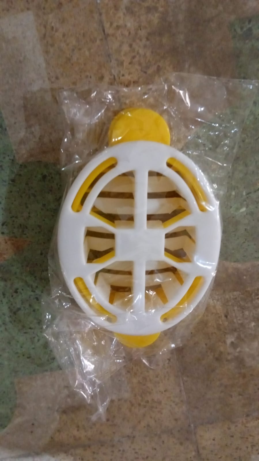 A lifestyle shot of the Quickslice egg slicer in a modern kitchen setting.