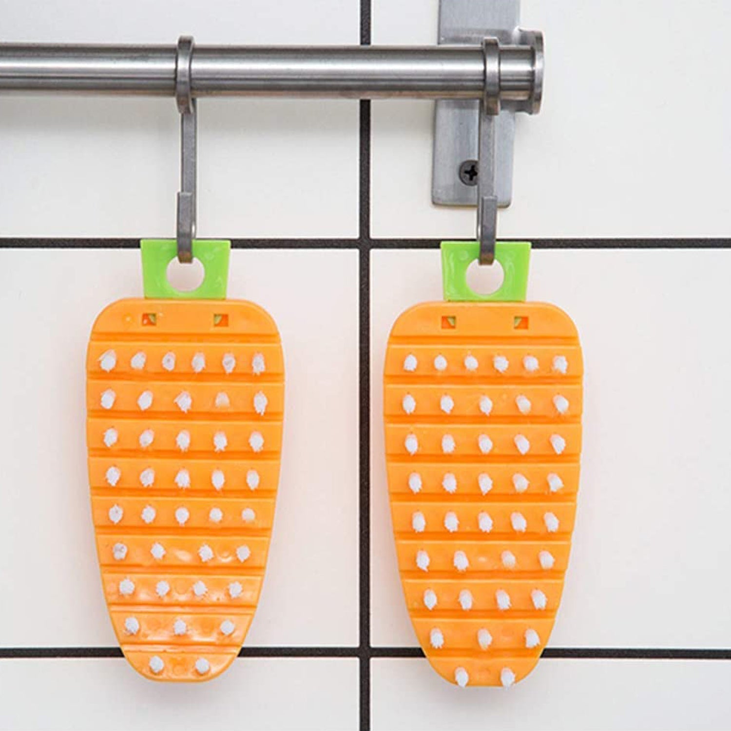Clean carrot-shaped vegetable brush after washing produce.