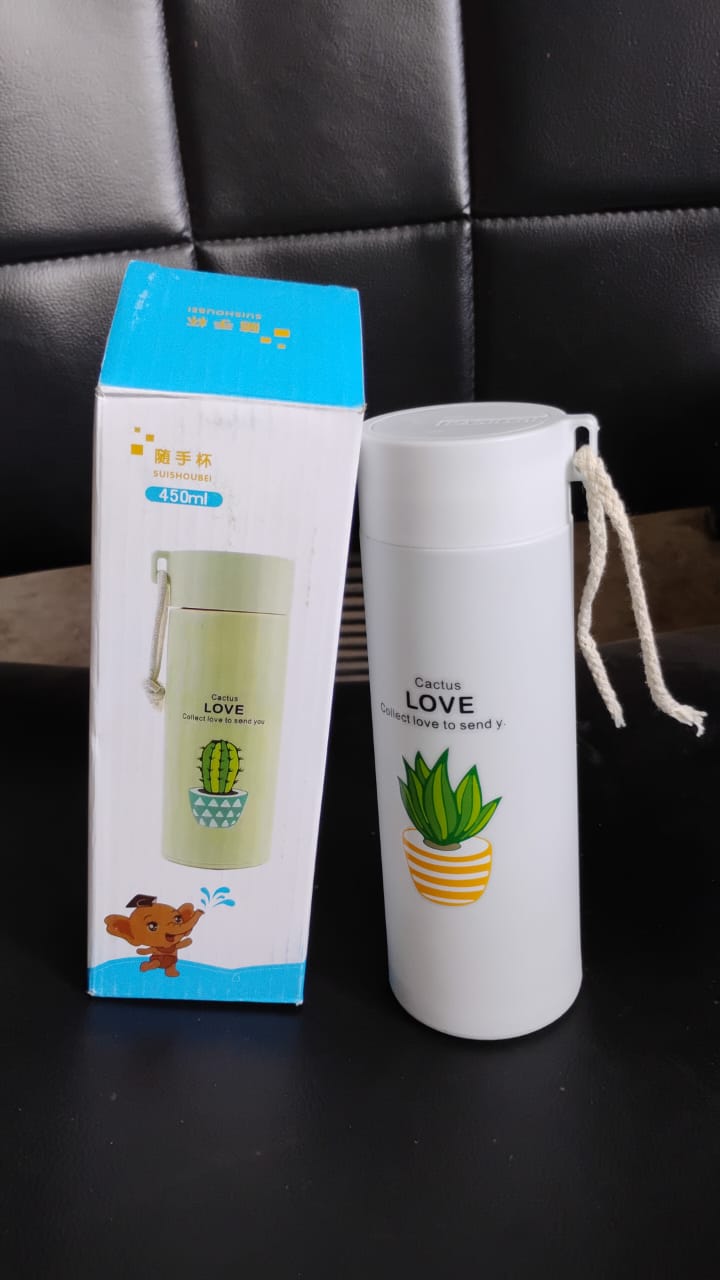 The portable glass water bottle being used during travel, emphasizing its convenience for fitness and adventure.