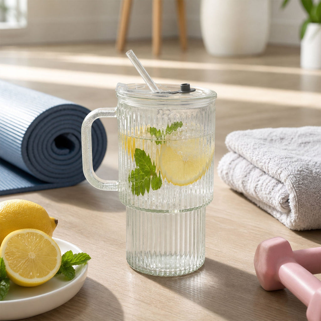 Glass tumbler in use for drinking cold beverage