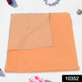 Stack of folded absorbent kitchen cleaning cloths.