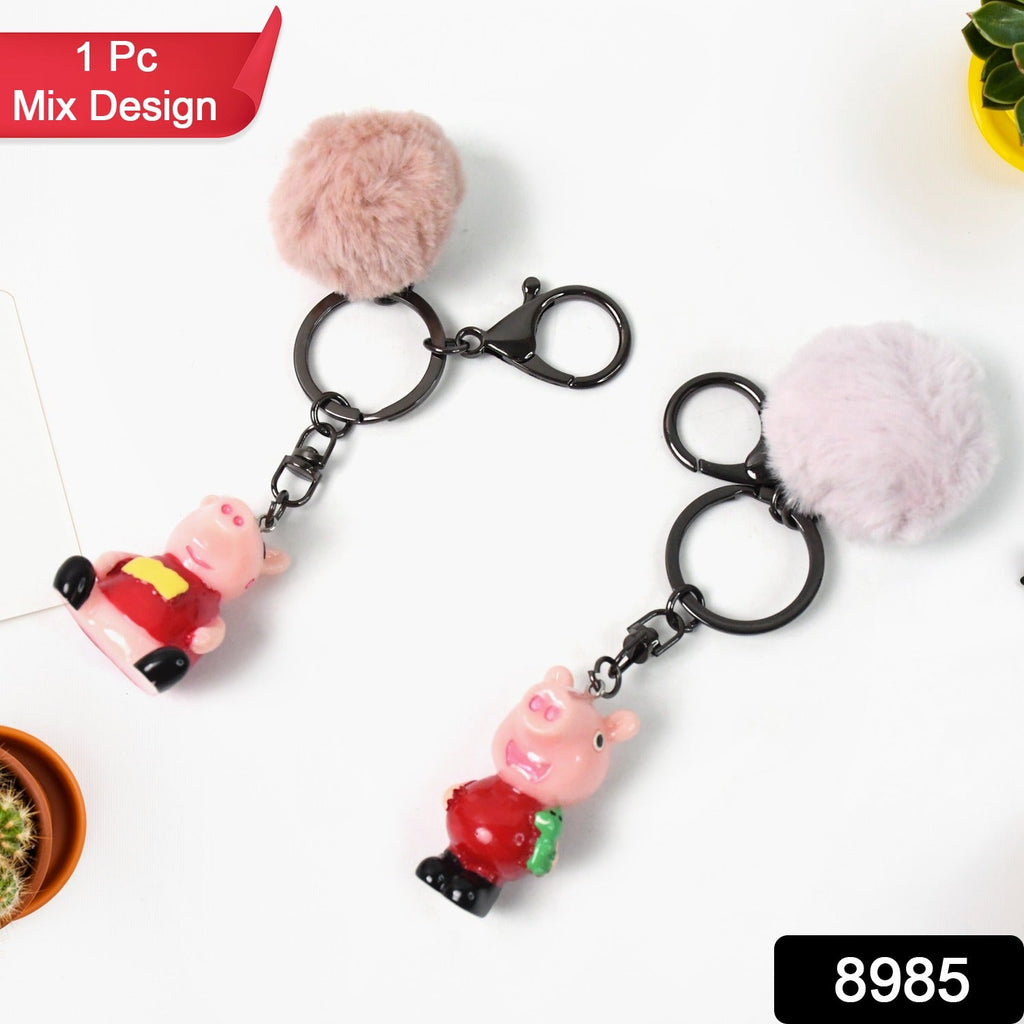 Kawaii cartoon keychain attached to bag featuring a soft fluffy pom pom