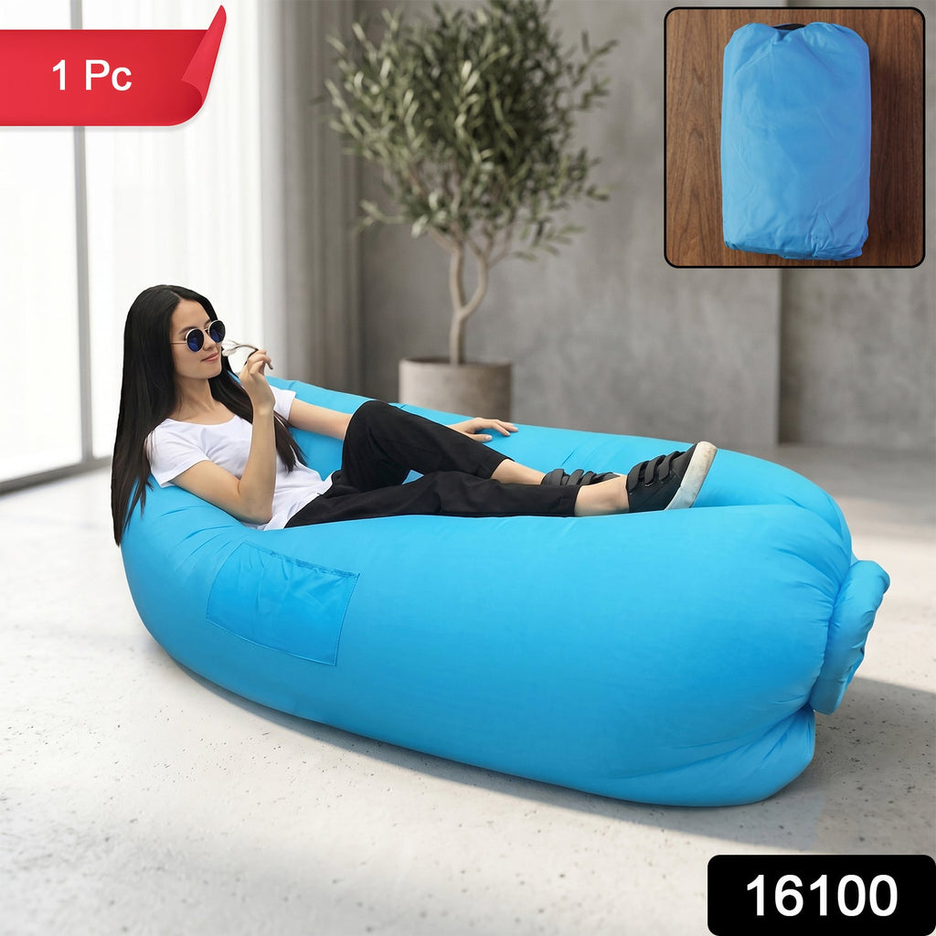 Person lounging on portable inflatable air sofa during outdoor activity