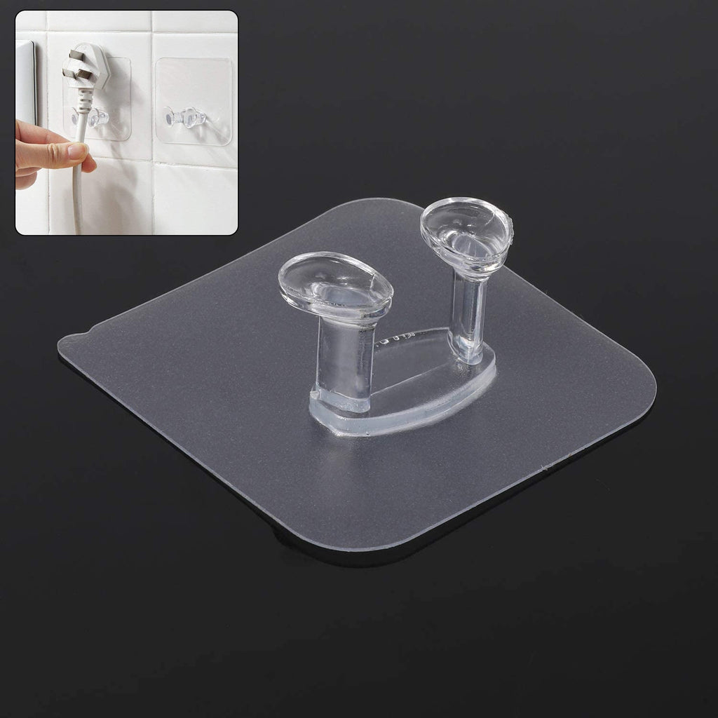 Transparent self-adhesive wall hook mounted on a clean, smooth wall.