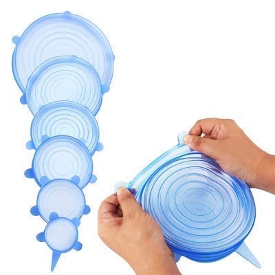 Tidy Table silicone stretch lids providing a leak-proof seal on a glass jar.
