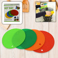 A single red silicone hot pot mat with a textured, non-slip surface.