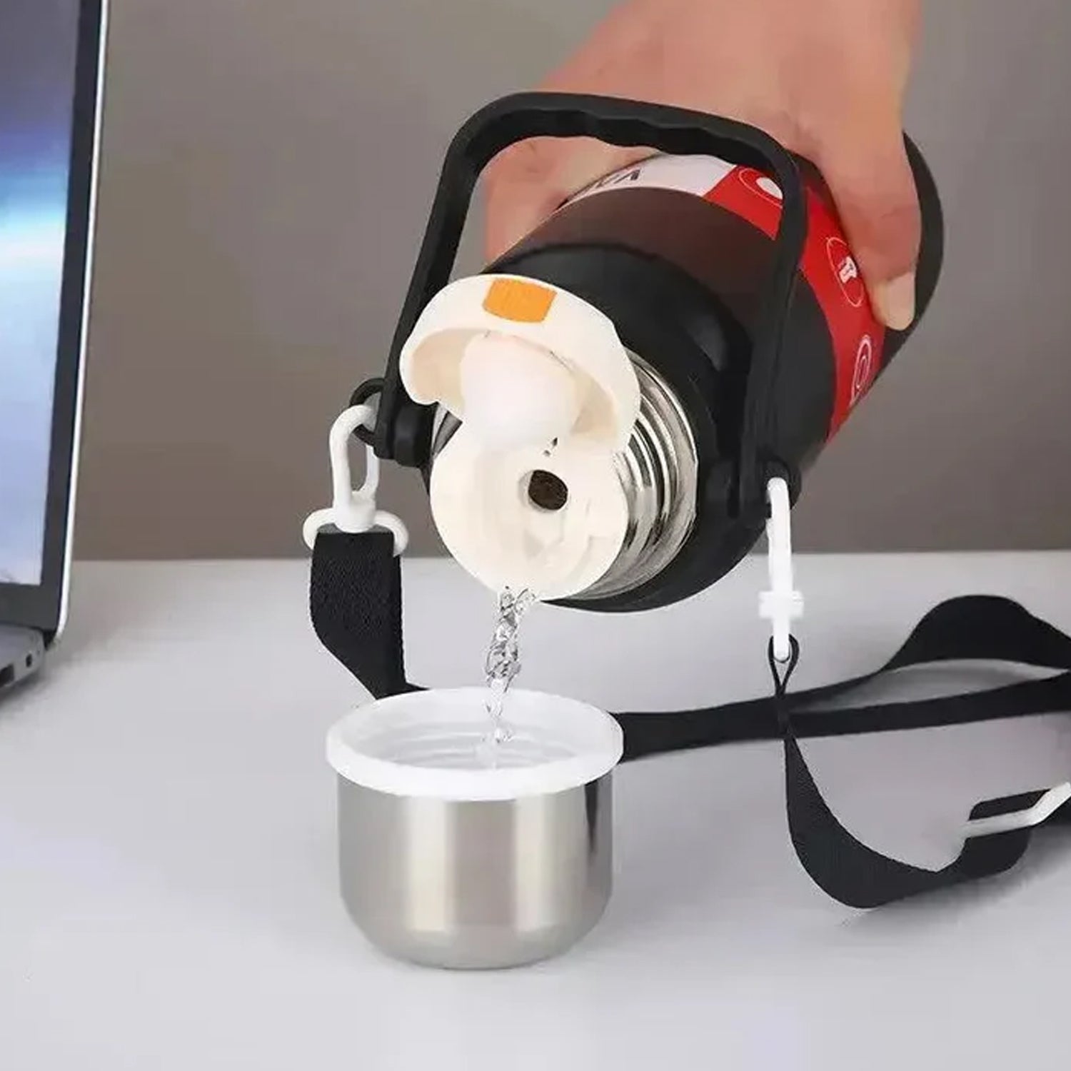 Vacuum insulated stainless steel thermos maintaining drink temperature