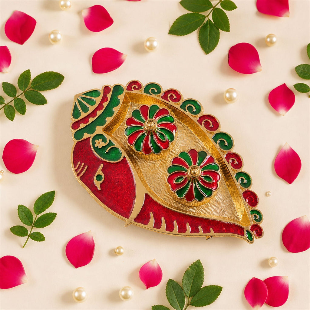 Close-up of golden finish and enamel decorated kumkum holder