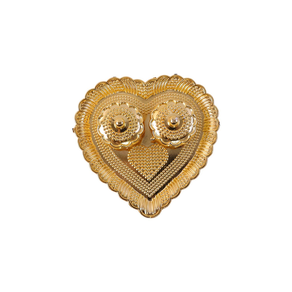 Kumkum holder with white background highlighting golden design