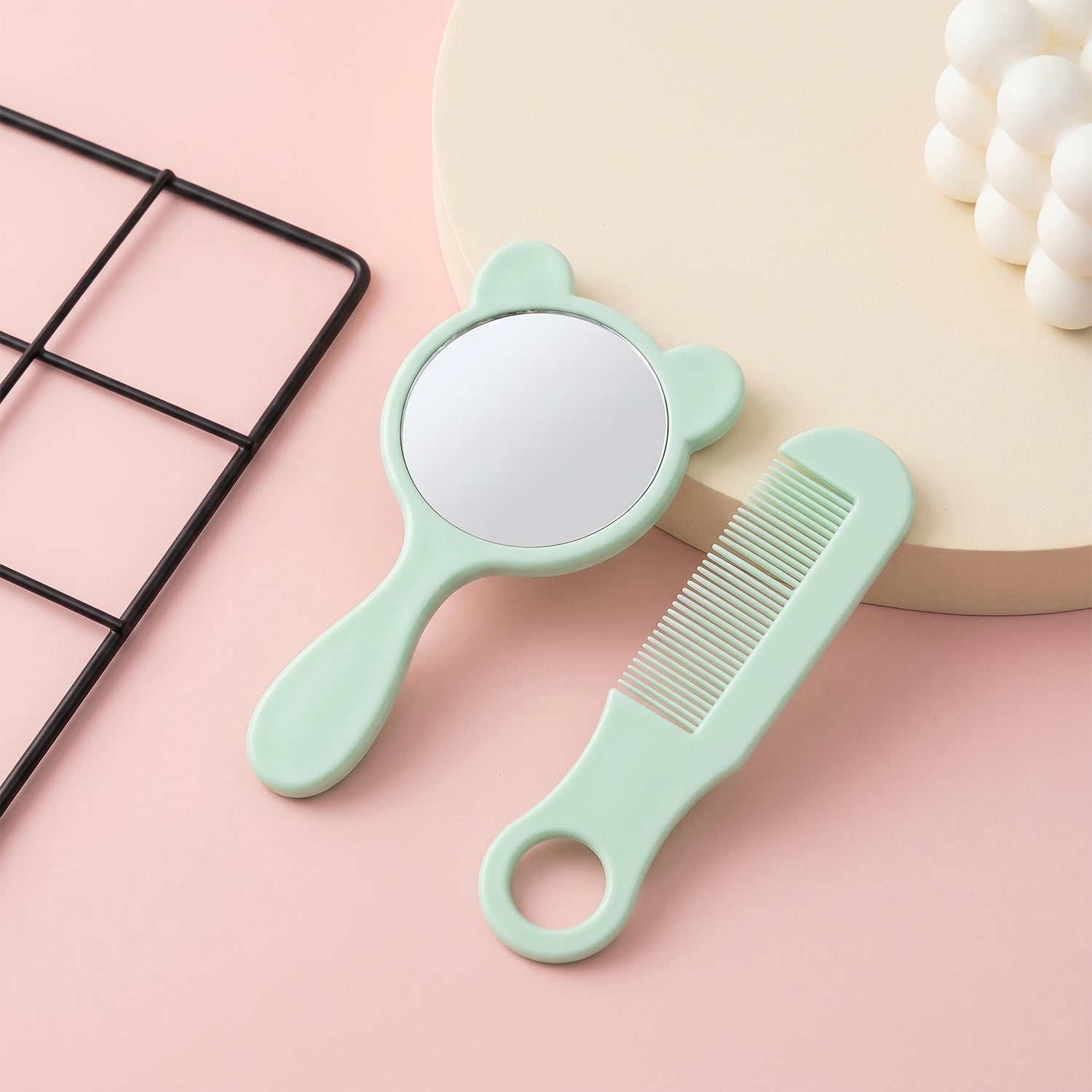 Close-up of cute comb mirror grooming kit details