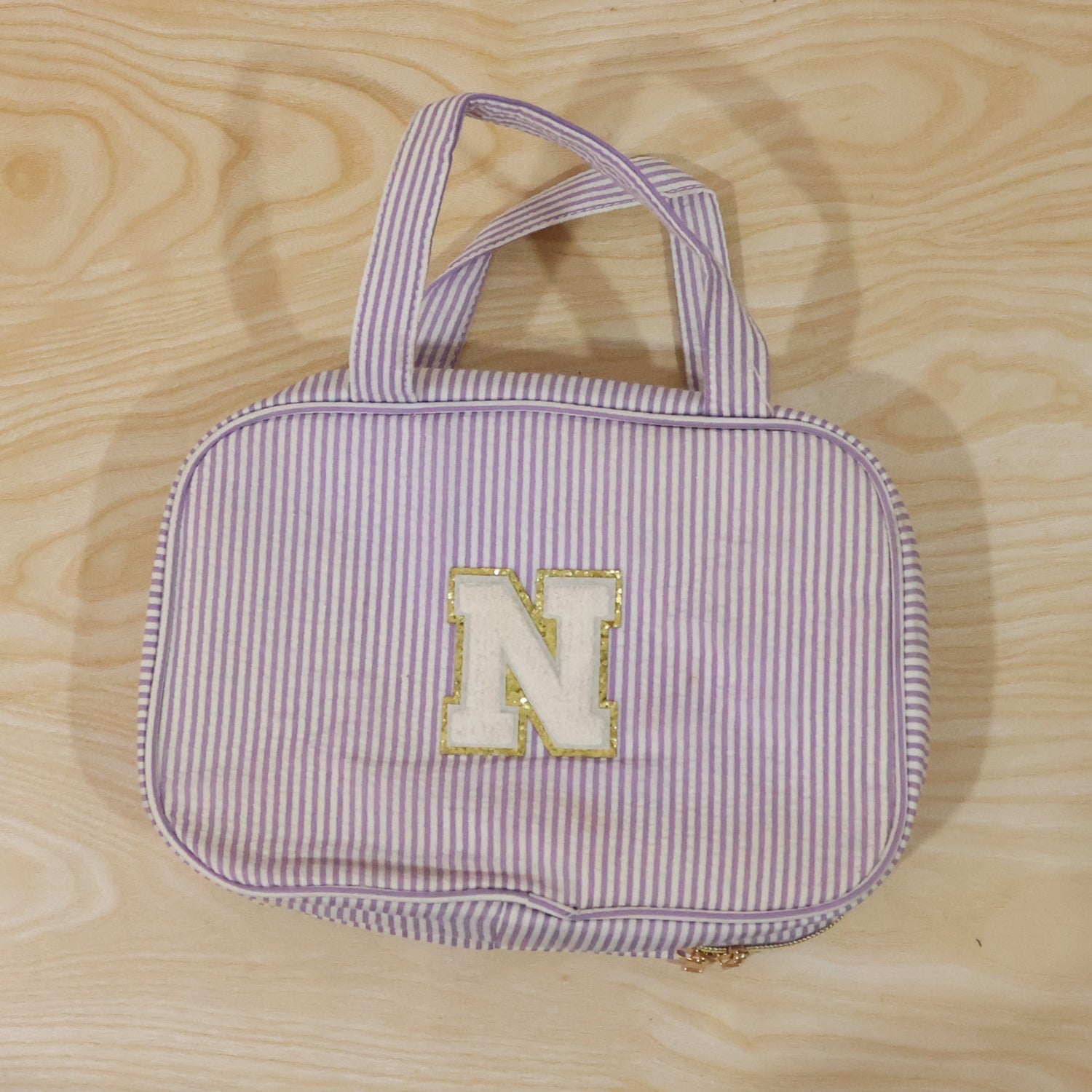 Detailed view of multi-pocket toiletry pouch with compartments