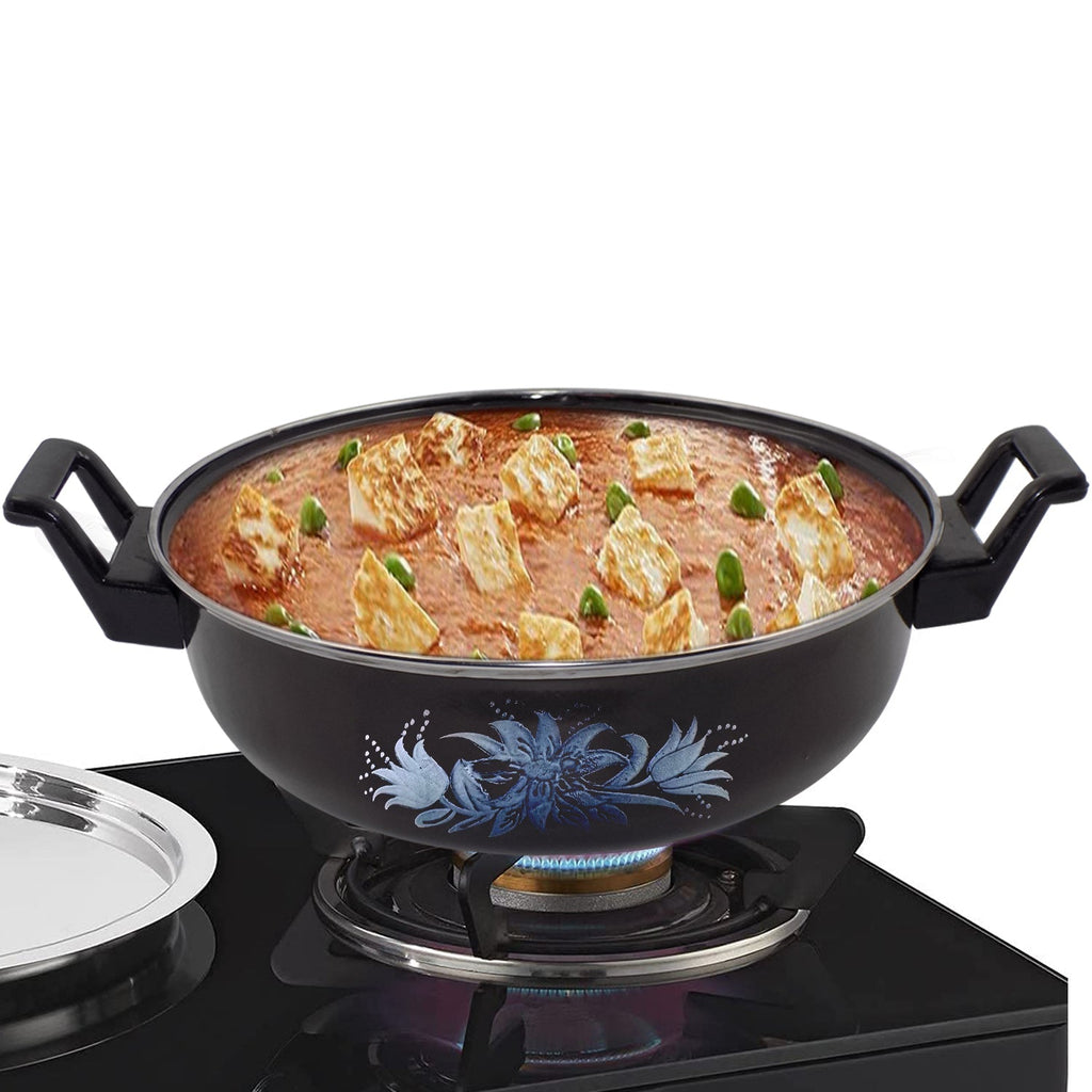 Traditional iron tava pan used for tempering spices