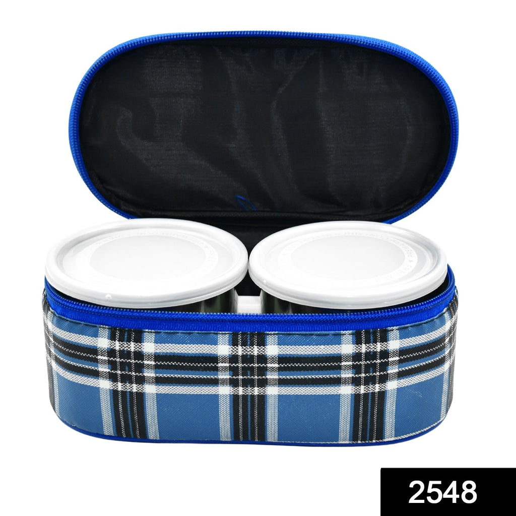 Three round stainless steel tiffin containers neatly stacked.