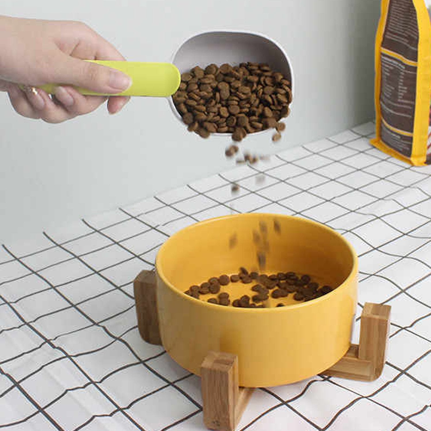 Close-up of the durable pet food scoop showing its food-grade ABS material.
