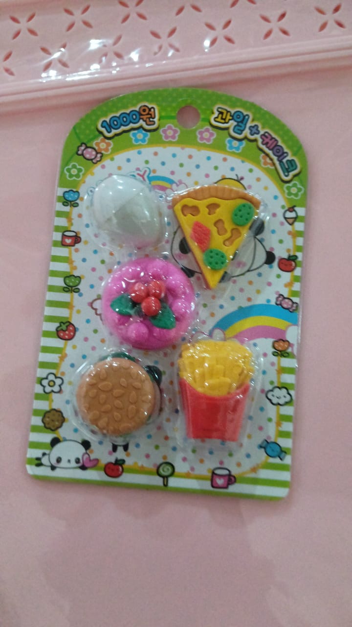 A group of cheerful food-shaped erasers, perfect for school stationery or party favors.