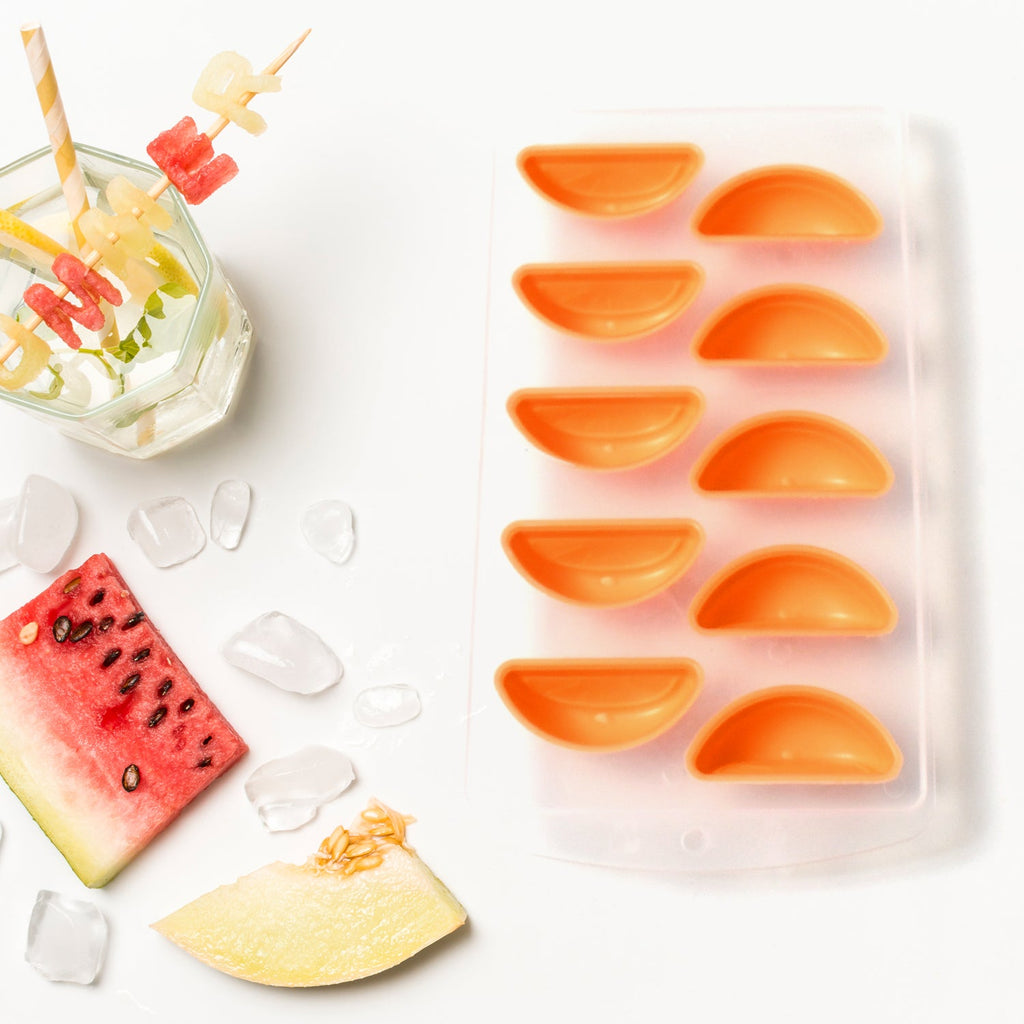 Refreshing fruit-shaped ice cubes ready for drinks.
