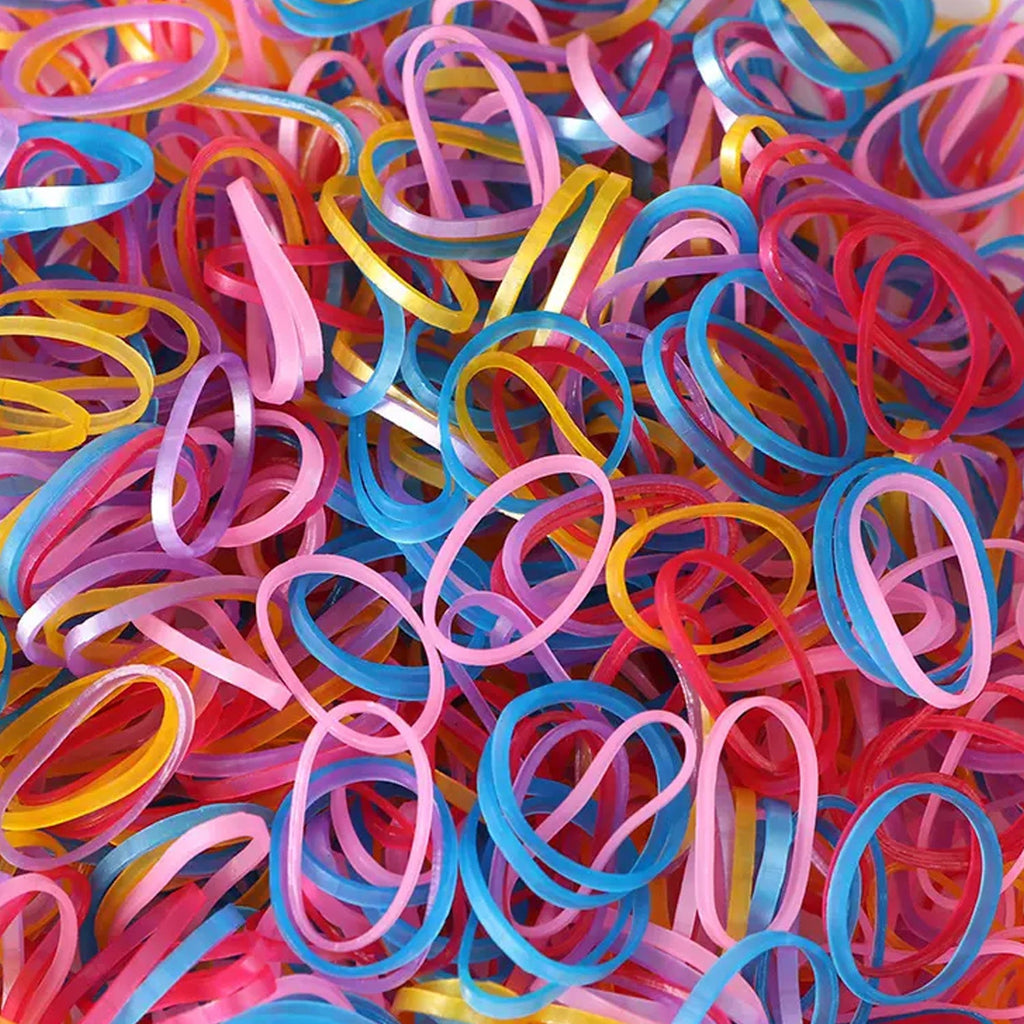 A neatly stacked pile of colorful multicolor rubber bands on a clean white background.
