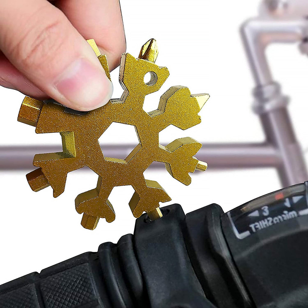 Close-up of the durable stainless steel Snowflake Multi-Tool, highlighting its intricate design.