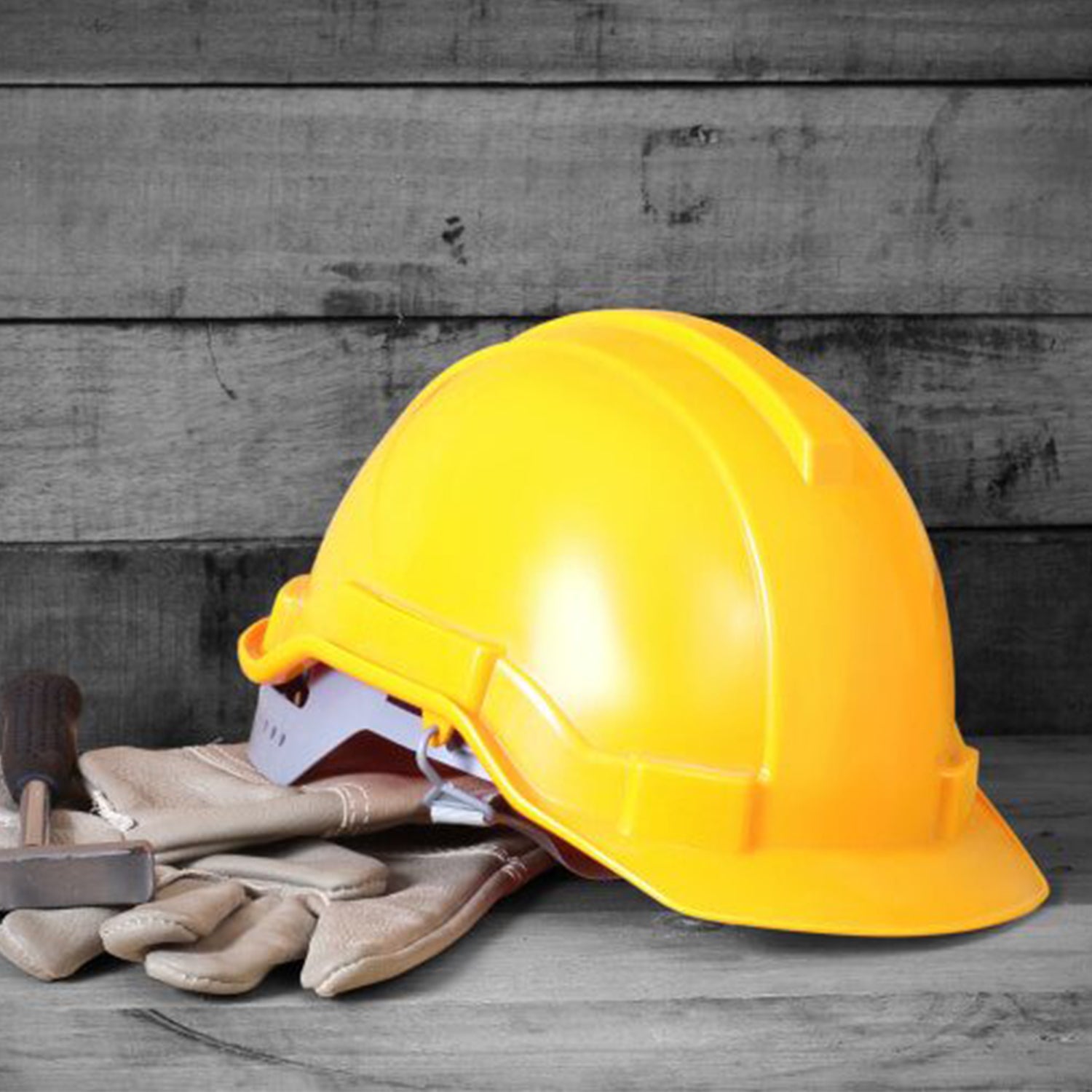Yellow Industrial Safety Helmet with ventilation for construction workers.