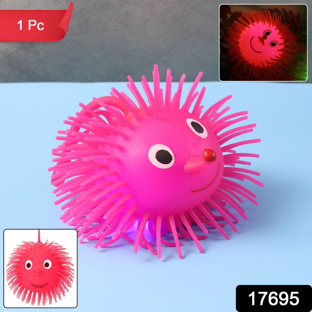Soft rubber LED spiky ball toy being held for sensory play
