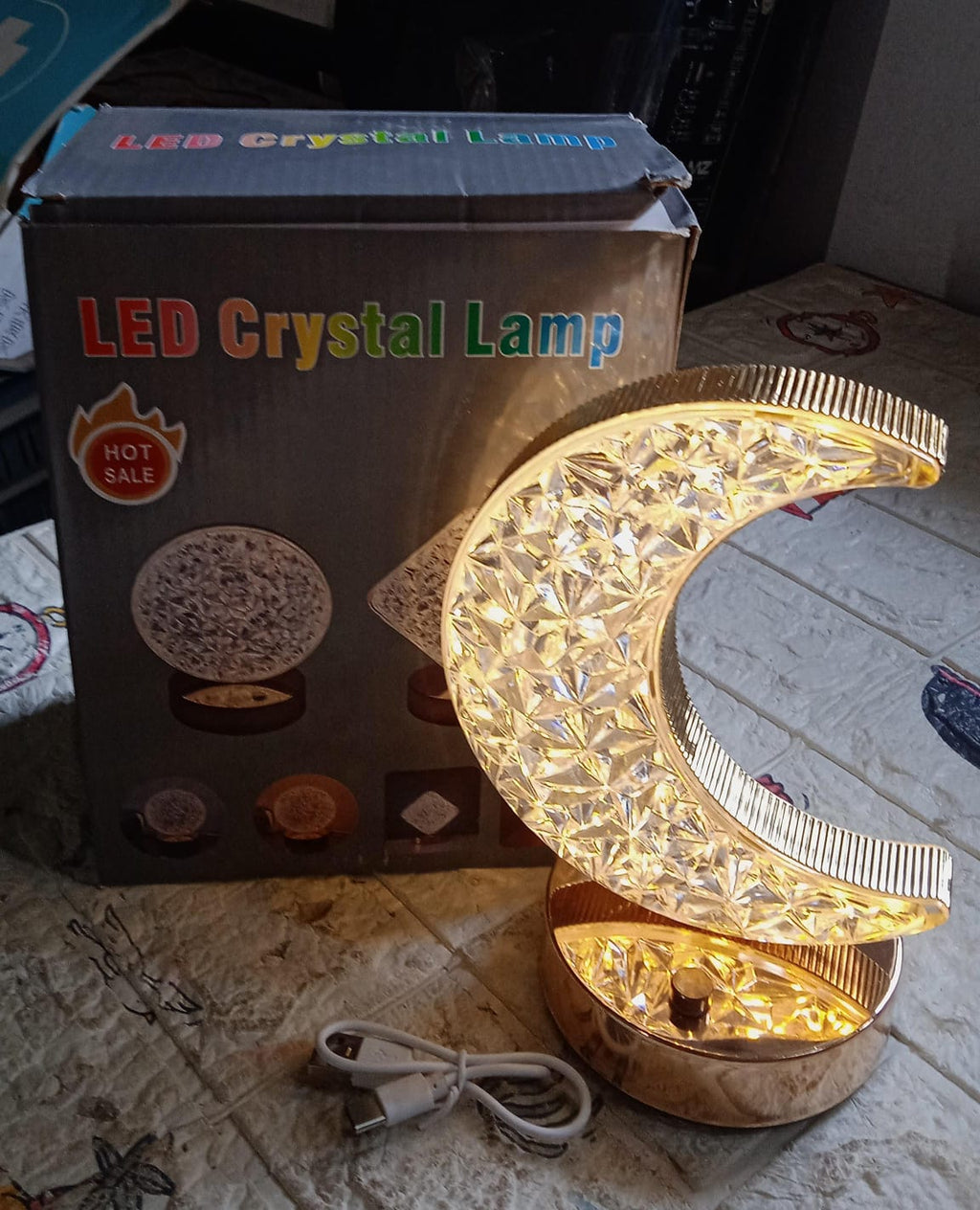 The Moon Crystal Lamp adding a modern and artistic touch to home decor.