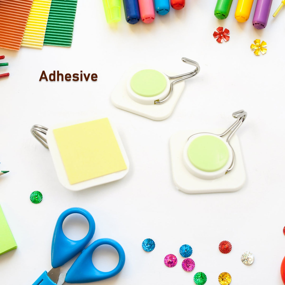 A set of three durable plastic wall hooks displayed on a white background.