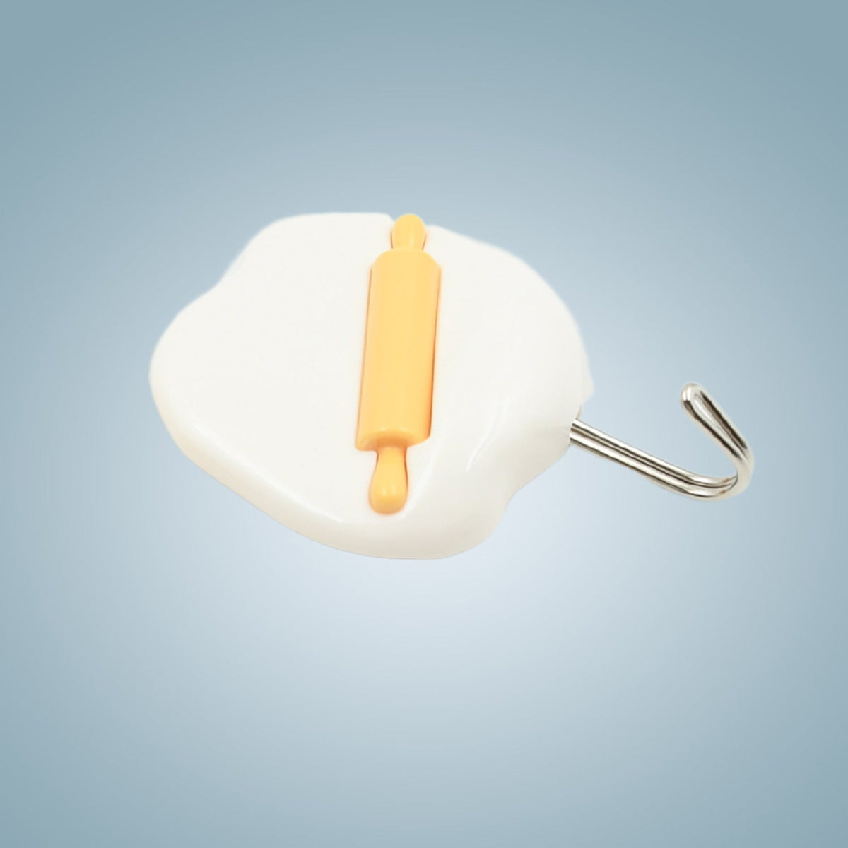 Strong adhesive hooks securely holding keys and small household items.