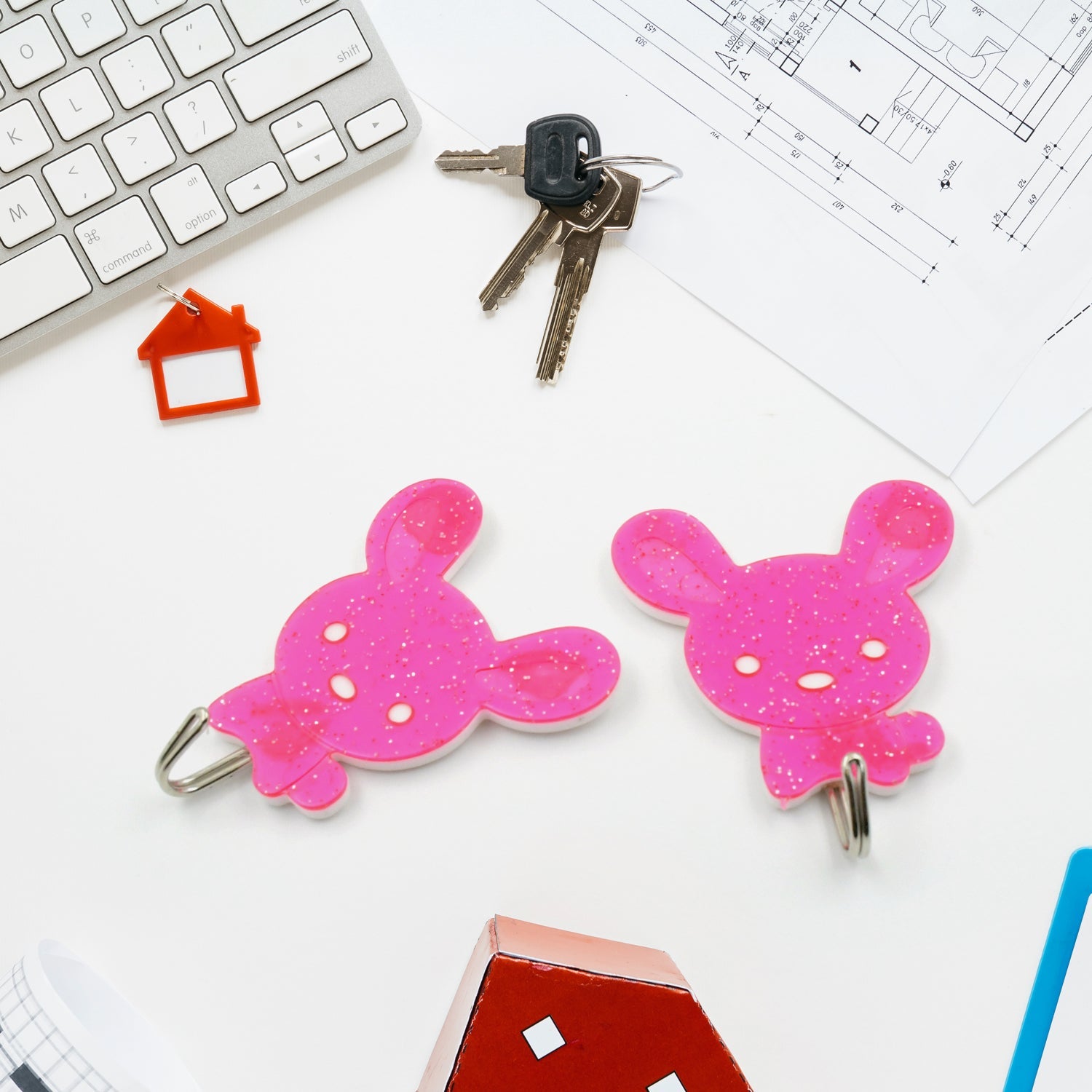 Stylish and waterproof self-adhesive hooks mounted on a kitchen wall.