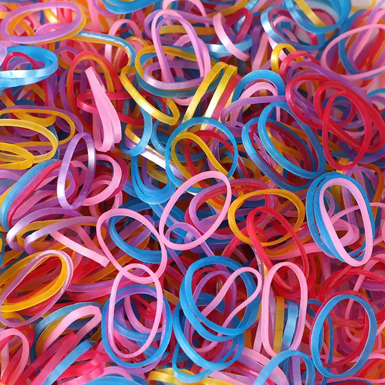 Multicolor rubber bands effectively bundling pencils and electronic cords on a desk.