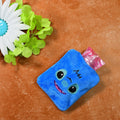Small blue hot water bag with a soft fabric cover, perfect for pain relief.