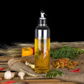 Clear plastic oil dispenser, 1 litre, with lid and drip-free spout.