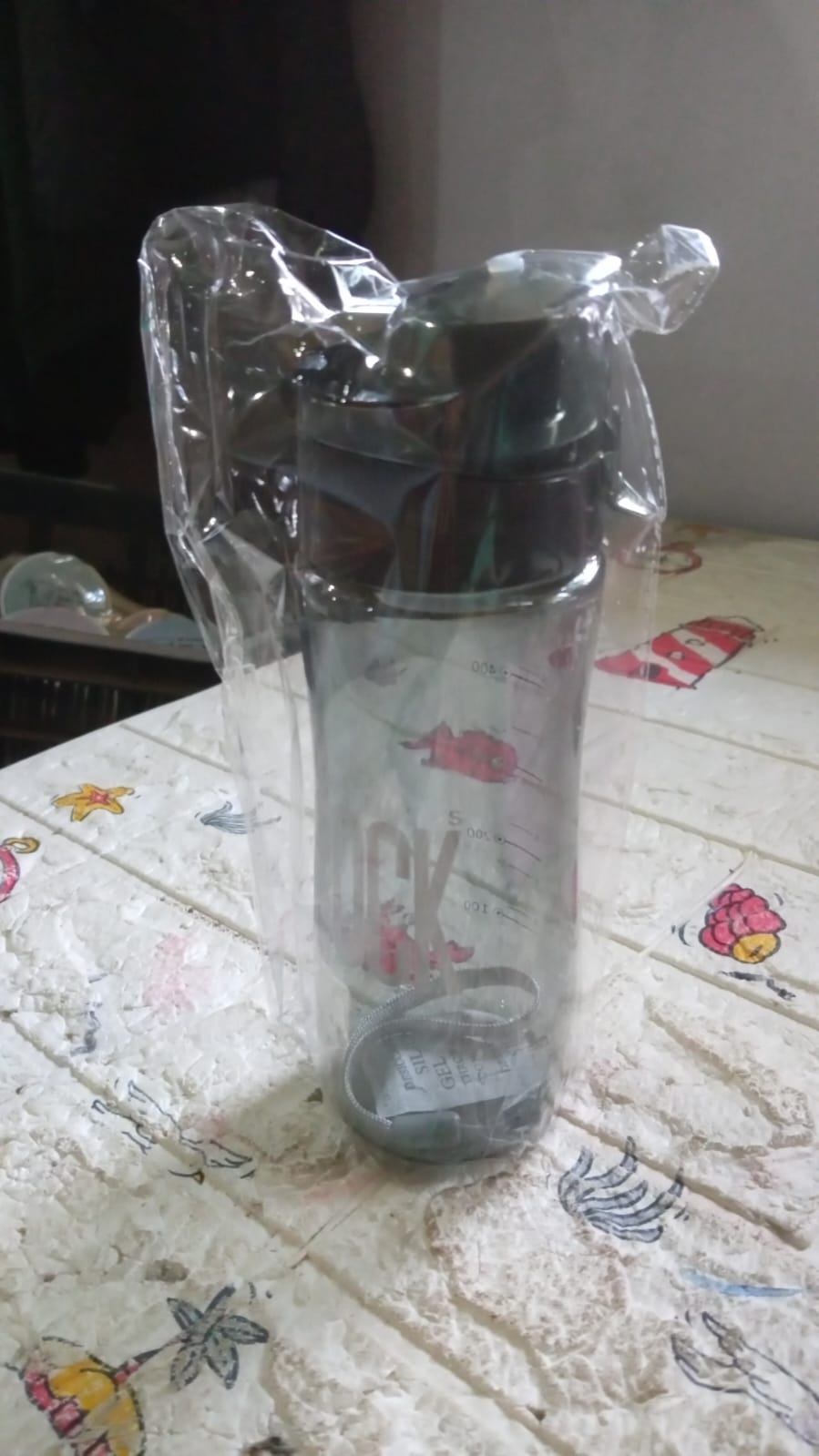Sports water bottle securely carried in a backpack for travel convenience.
