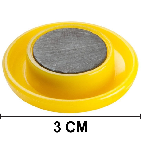 Kids' magnetic buttons securely sticking to a metal surface.