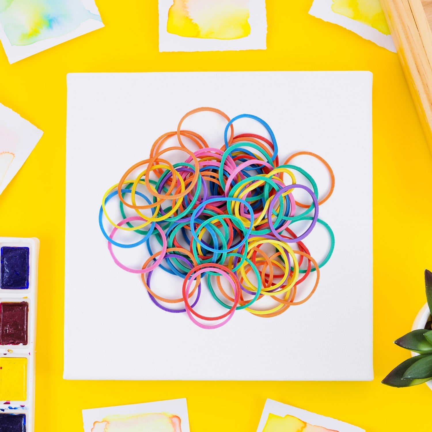 Versatile rubber bands used in a DIY art and craft project.