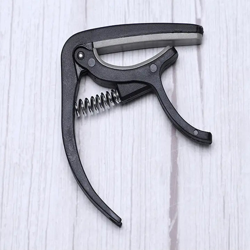Detail of the Wagtail guitar capo's protective soft pad, preventing instrument damage.