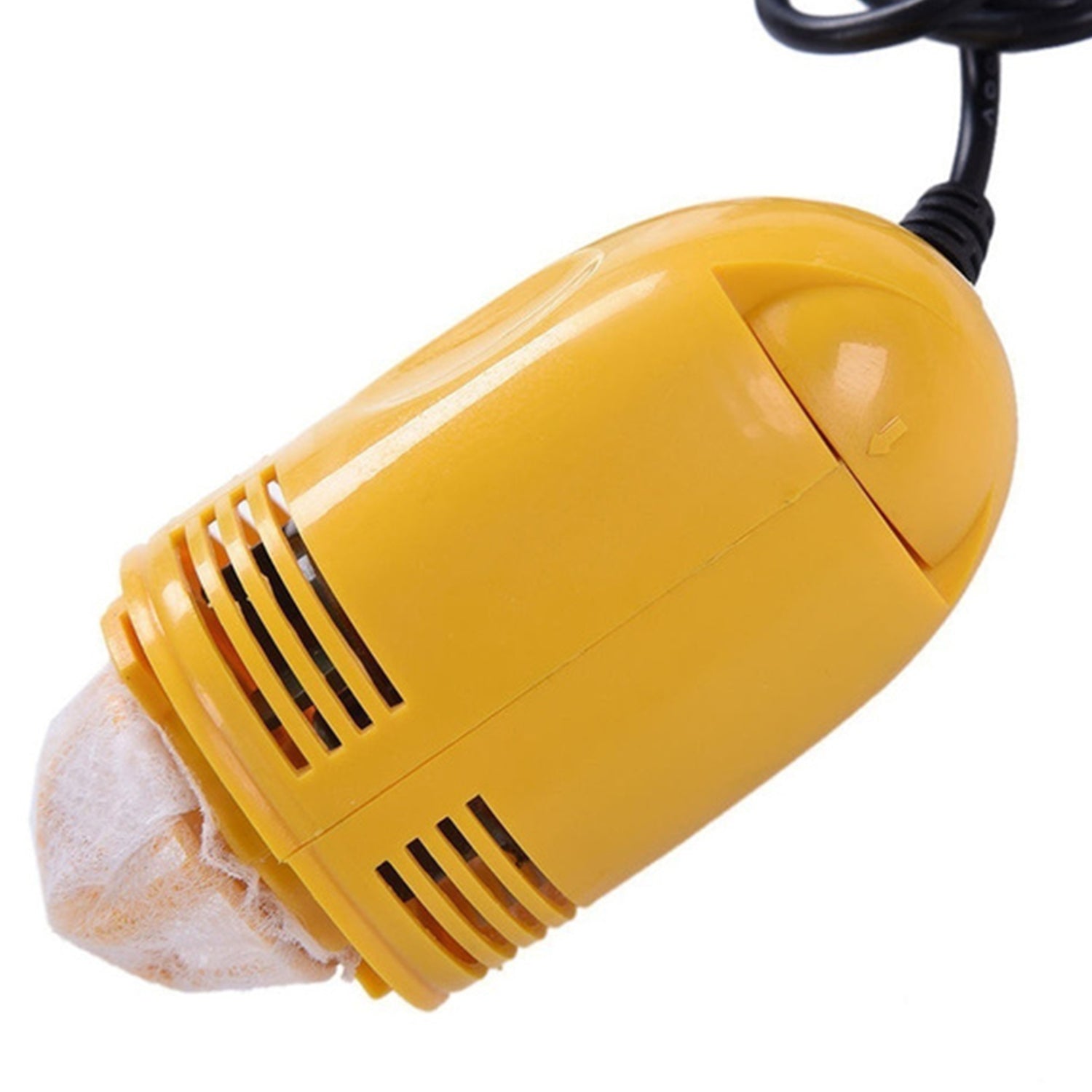 USB mini vacuum cleaner in action, cleaning a dusty computer keyboard.
