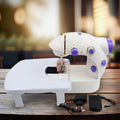 Mini Sewing Machine with extension table, foot pedal, and adapter on a clean surface.