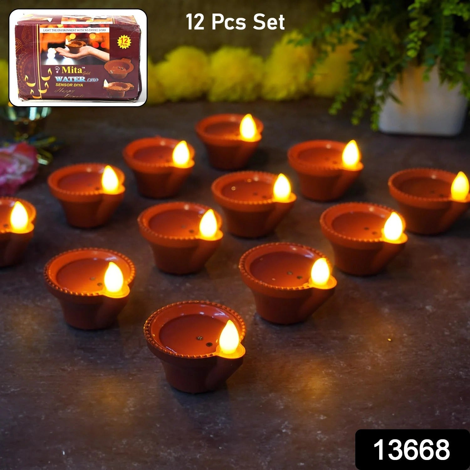 A close-up of a water sensor diya illuminating a rangoli design.