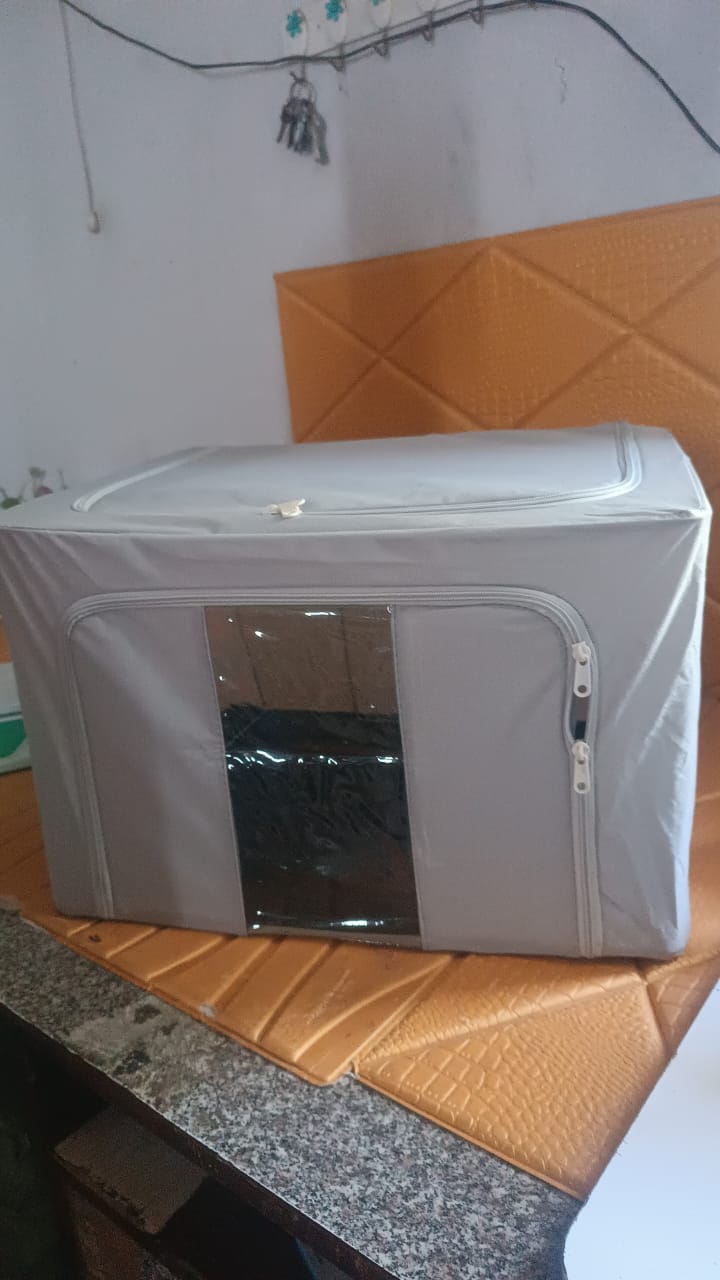 Foldable storage box with zipper and transparent window for seasonal clothing